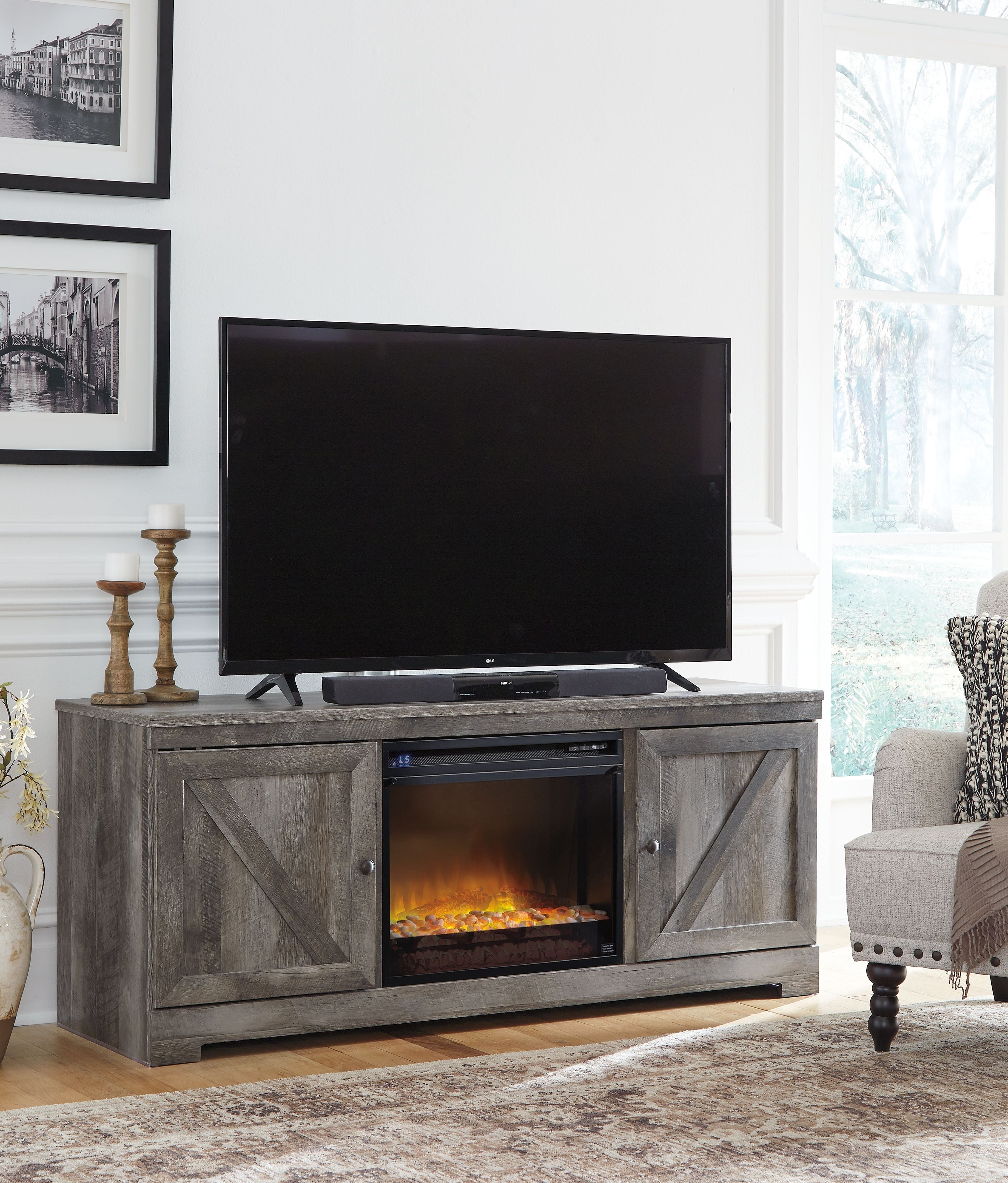 Wynnlow - 63" TV Stand With Glass/Stone Fireplace Insert - Gray